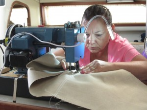 Diann sews the canvas for the dinghy girdle