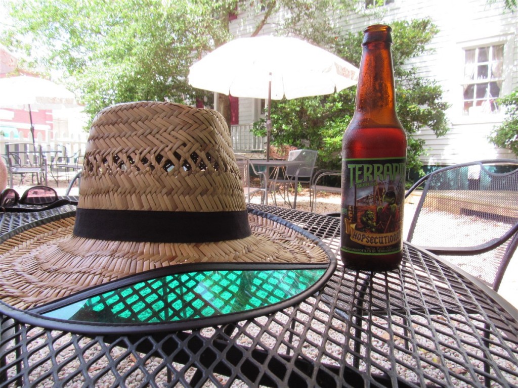 An "IPA" in the shade of trees in the Market's garden.