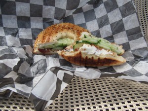 Bagel with bacon, cream cheese, and cucumber