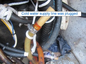 Pressurized cold water inlet hose had been plugged