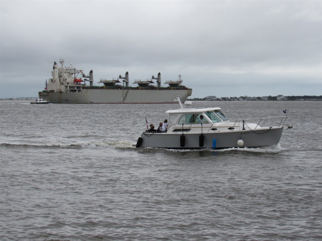 Commercial ship heading to the inlet; other boat to the ICW south 